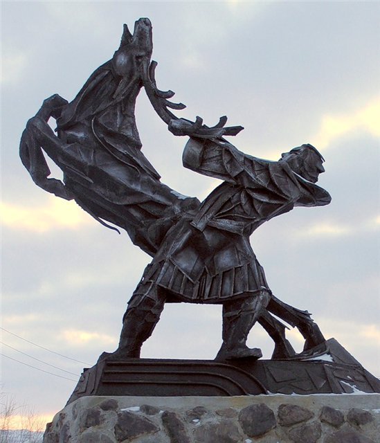 Памятник с ружьем и утками фото